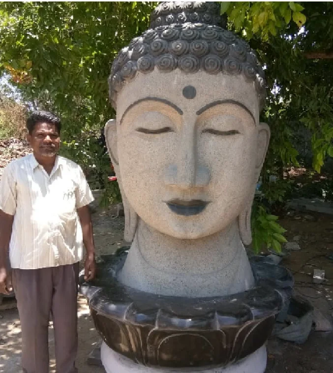 Sculptor with a carved temple bust
