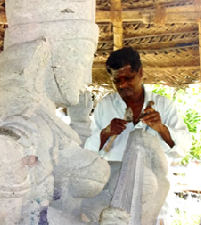 Sculptor working on a temple carving